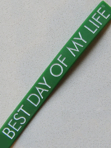green wristband with best day of my life written in white